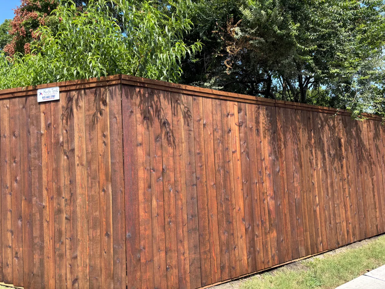 6’ & 8’ pre-stained western red cedar fence side by side style with double trim. — Wylie