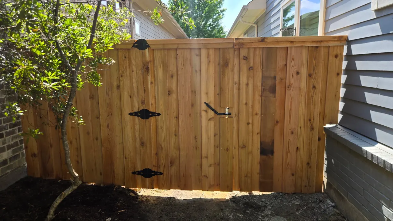 6 ft Cedar board on board w/ double trim & pressure treated 2” x 6”. — Garland