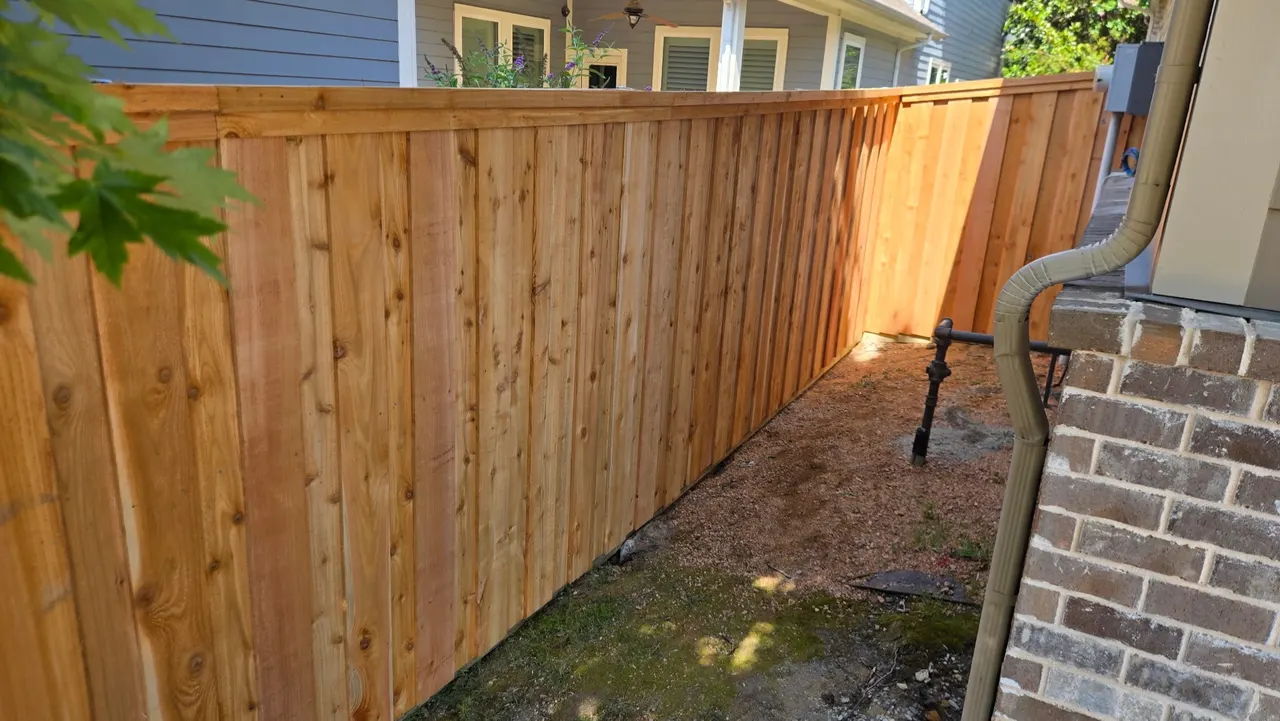 6 ft Cedar board on board w/ double trim & pressure treated 2” x 6”. — Garland