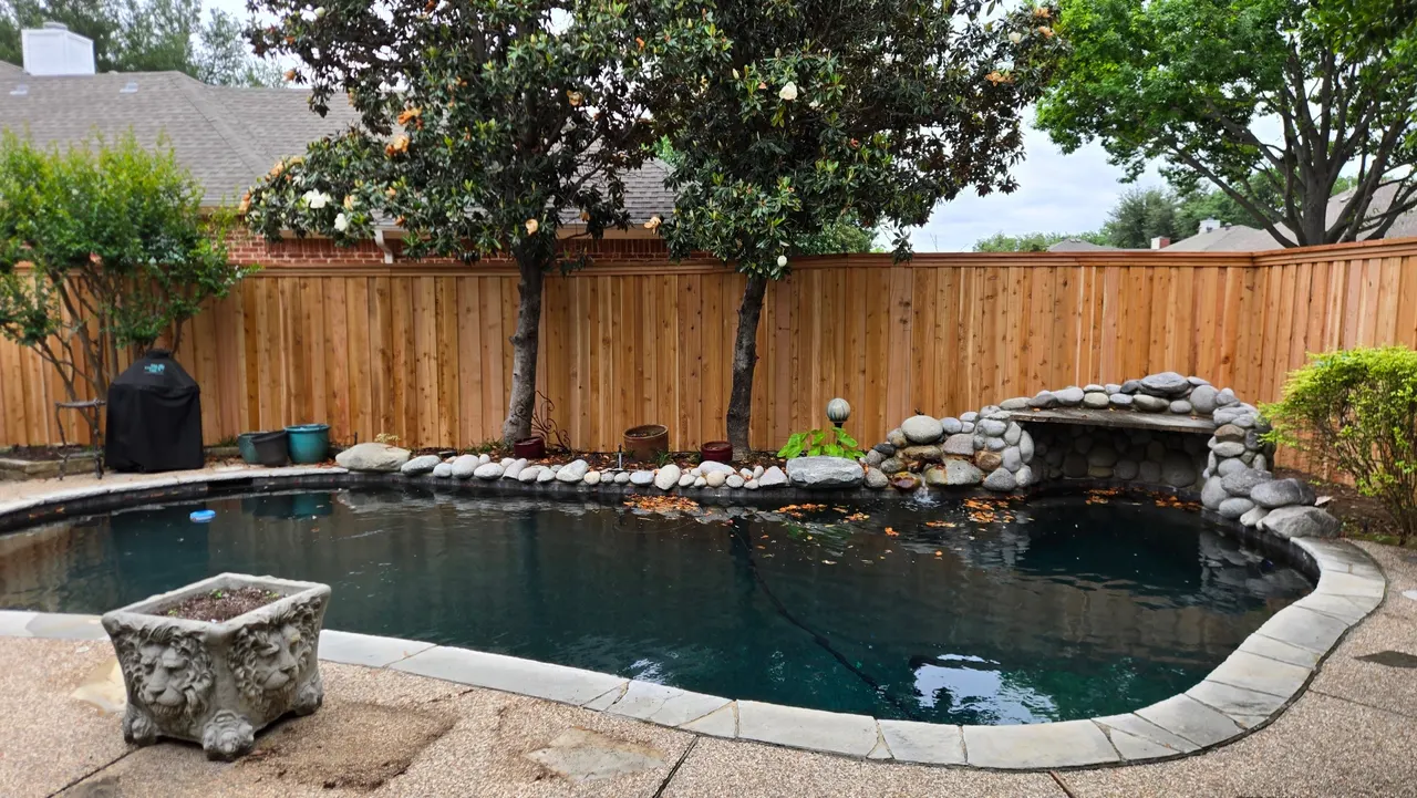 7 ft cedar board on board fence with double trim and 2” x 8” cedar cap. — Carrollton