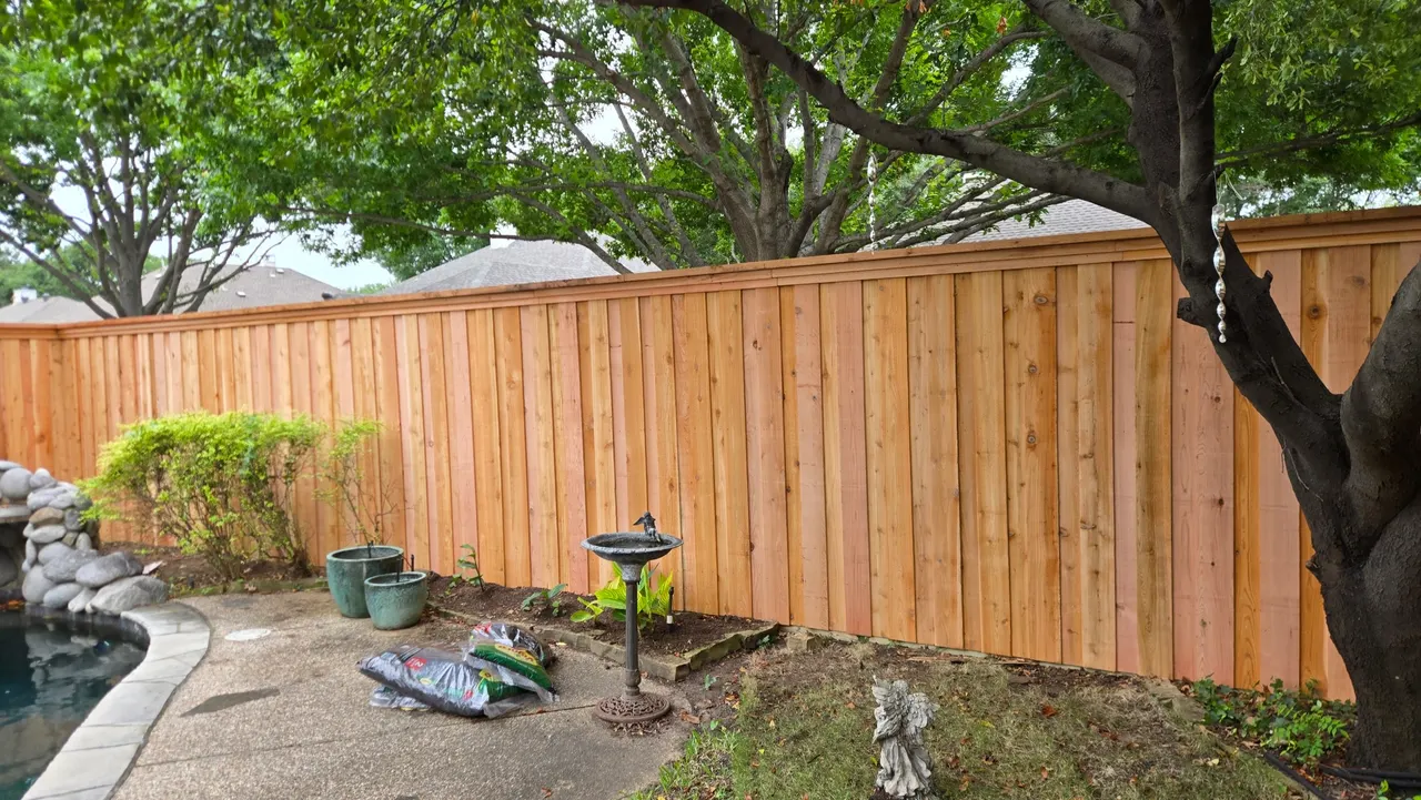 7 ft cedar board on board fence with double trim and 2” x 8” cedar cap. — Carrollton