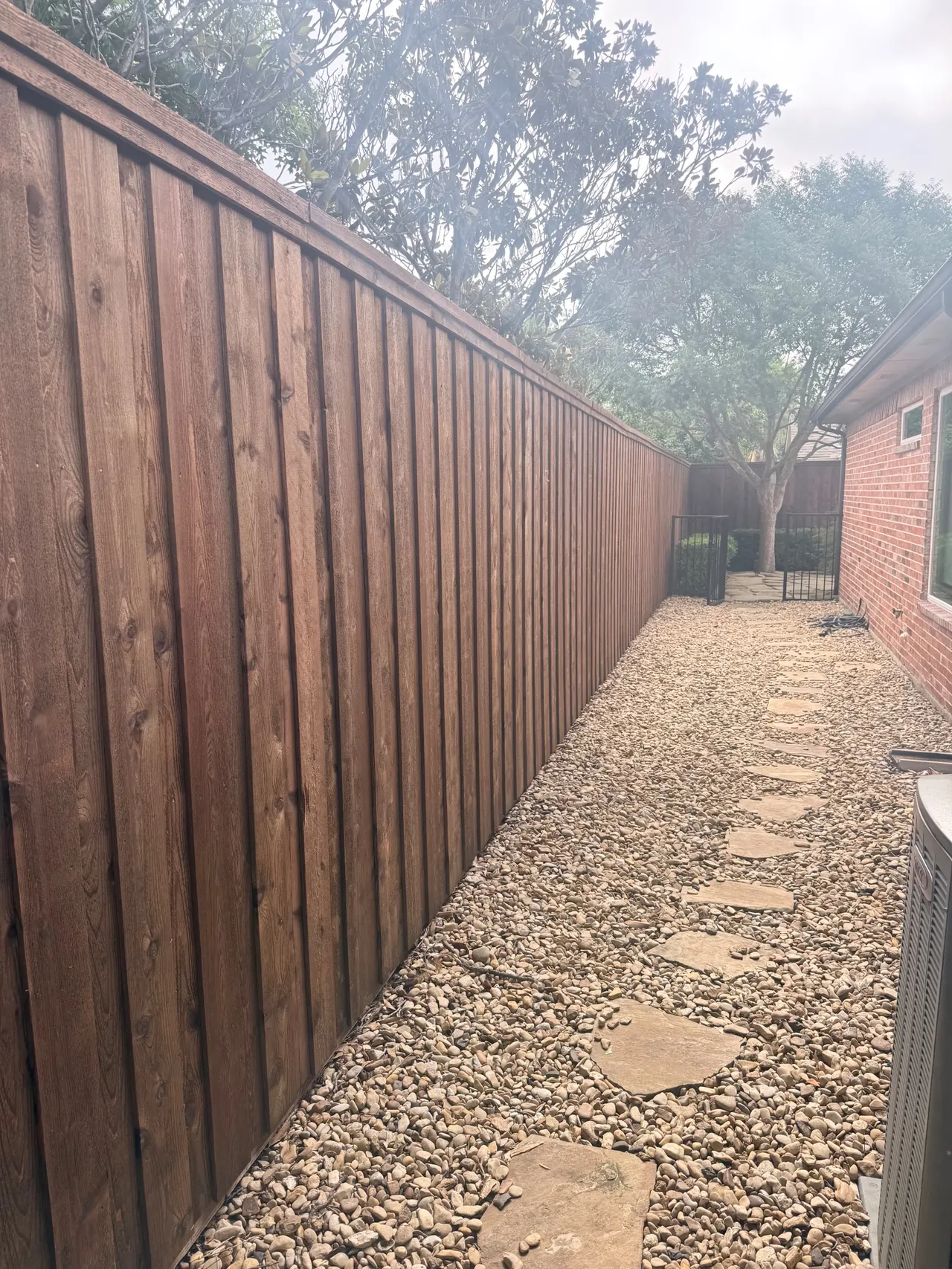 8ft Cedar Board on Board fence pre stained Classic Cedar tone color. — Plano