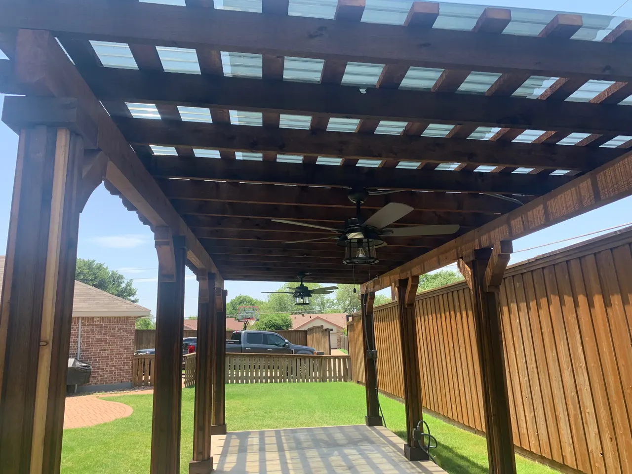 Cedar Pergola w/ Corrugated plastic across the top. — Plano