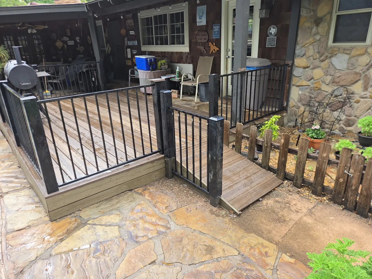 Composite deck- Black Walnut color, 3 ft. Tall wrought iron handrails. — Frisco
