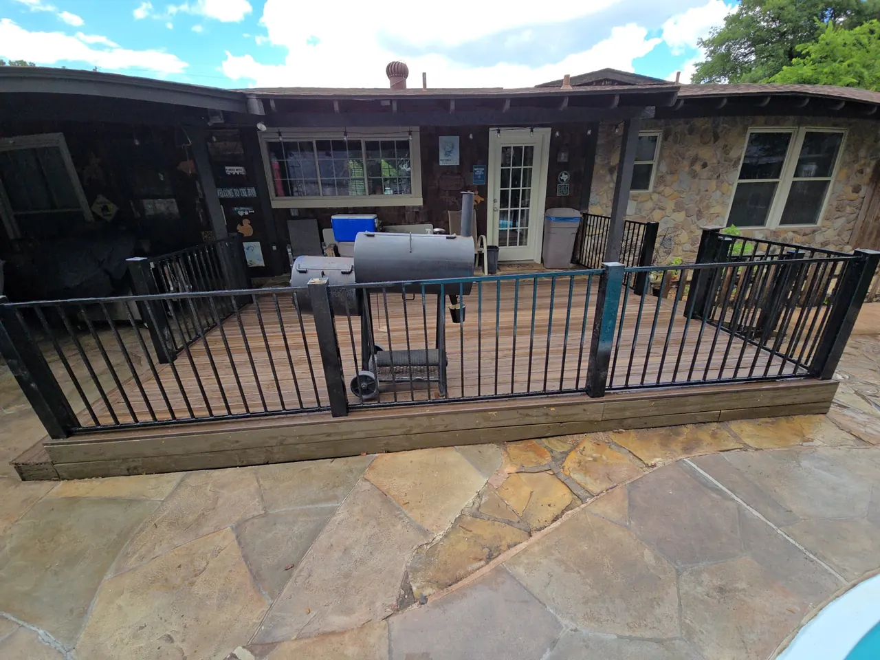 Composite deck- Black Walnut color, 3 ft. Tall wrought iron handrails. — Frisco