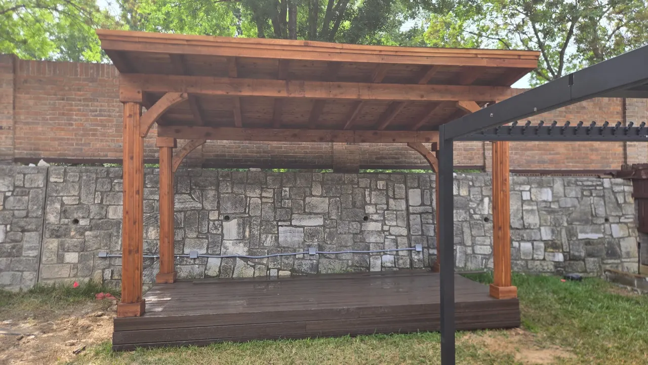 Composite deck color Black Walnut with a cedar patio cover stained. — Garland