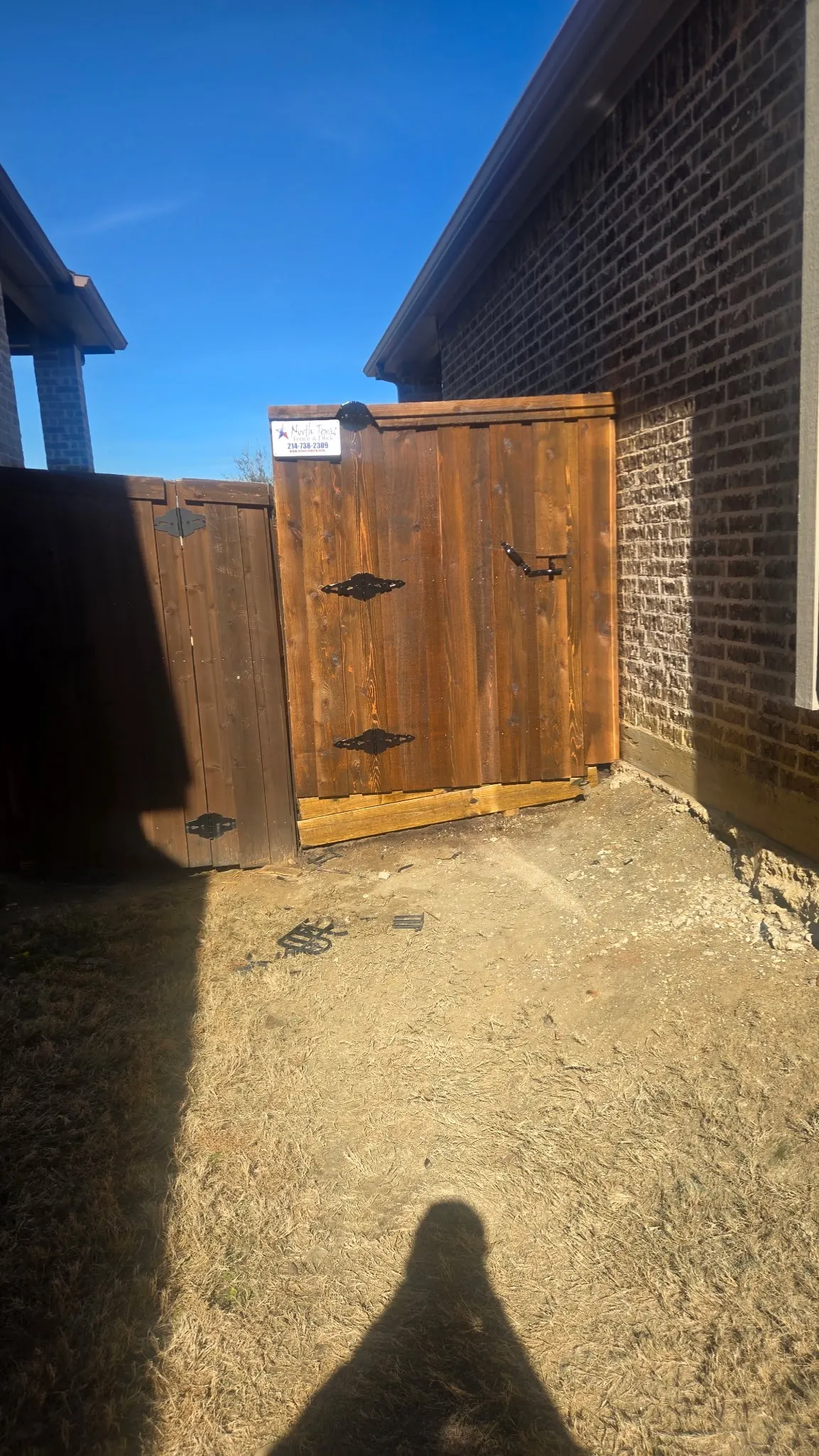 Pre-stained 6 ft cedar board on board w/ a 1 ft tall pressure treated retaining wall and added seller fill dirt to level out the side yard. — Frisco