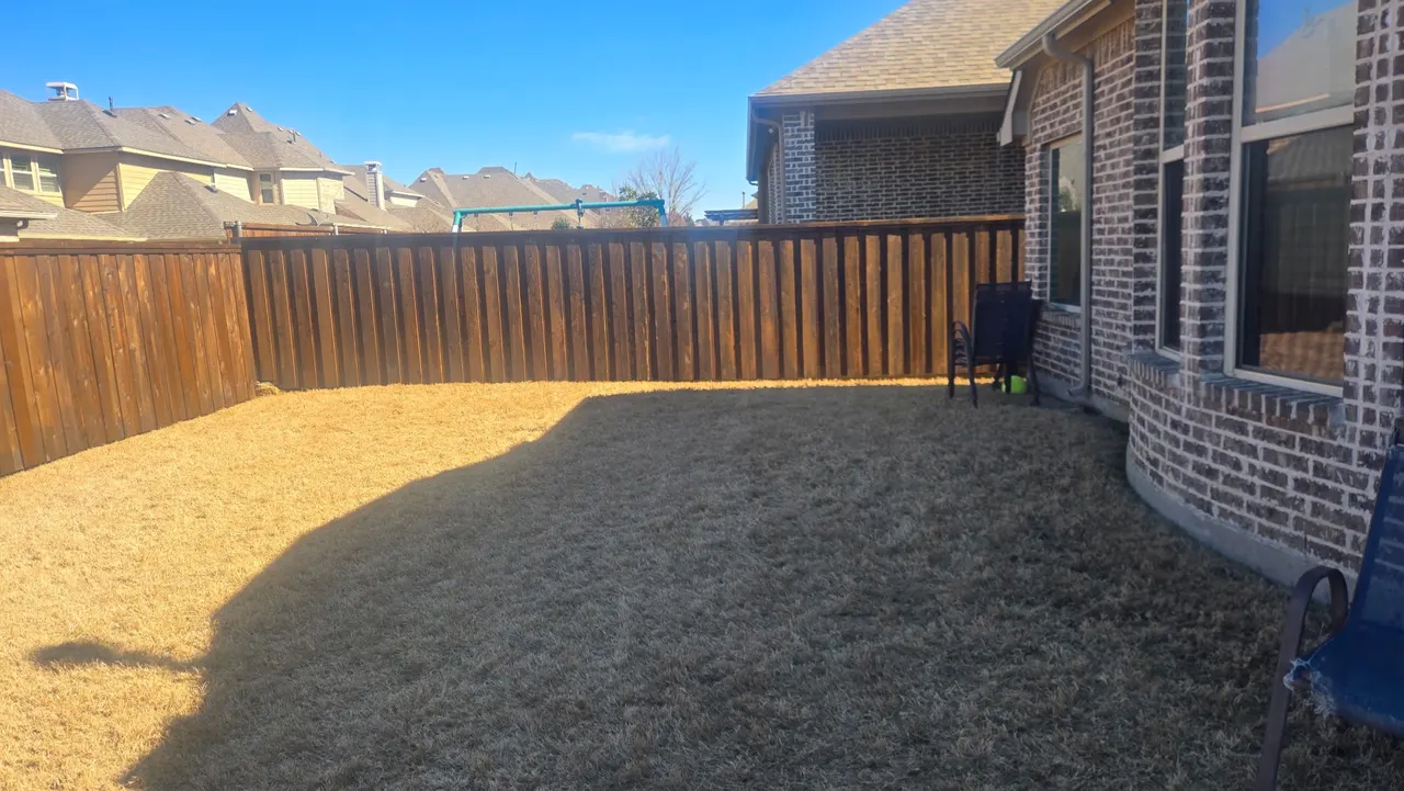 Pre-stained 6 ft cedar board on board w/ a 1 ft tall pressure treated retaining wall and added seller fill dirt to level out the side yard. — Frisco