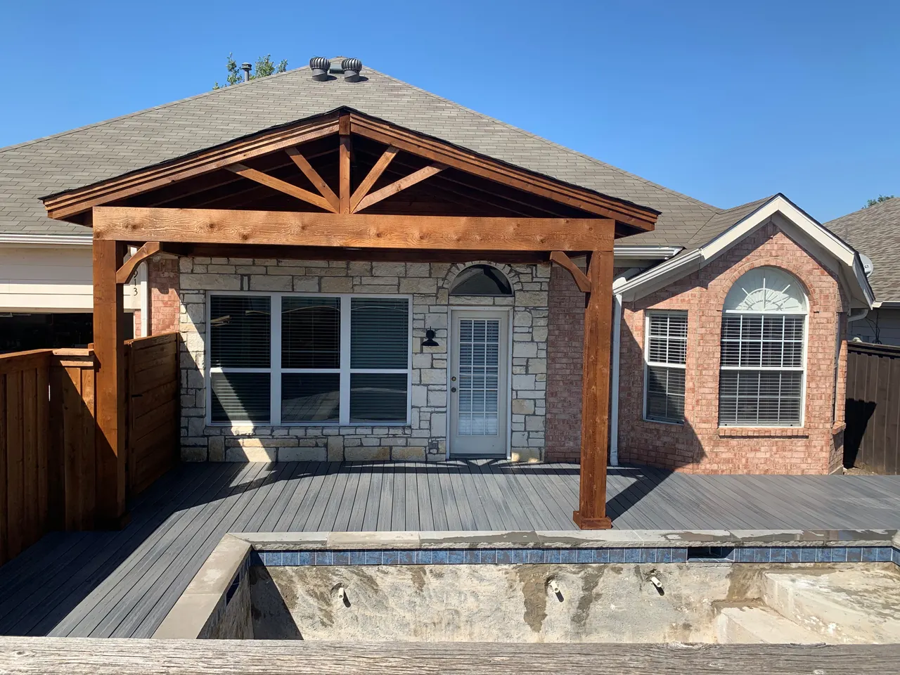 Western red cedar gable style patio cover and harbor grey color composite deck — Richardson