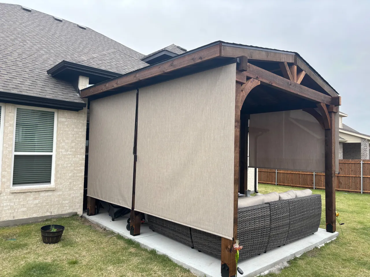 Western red cedar Gable style patio cover with roll down sun shades. — Lavon