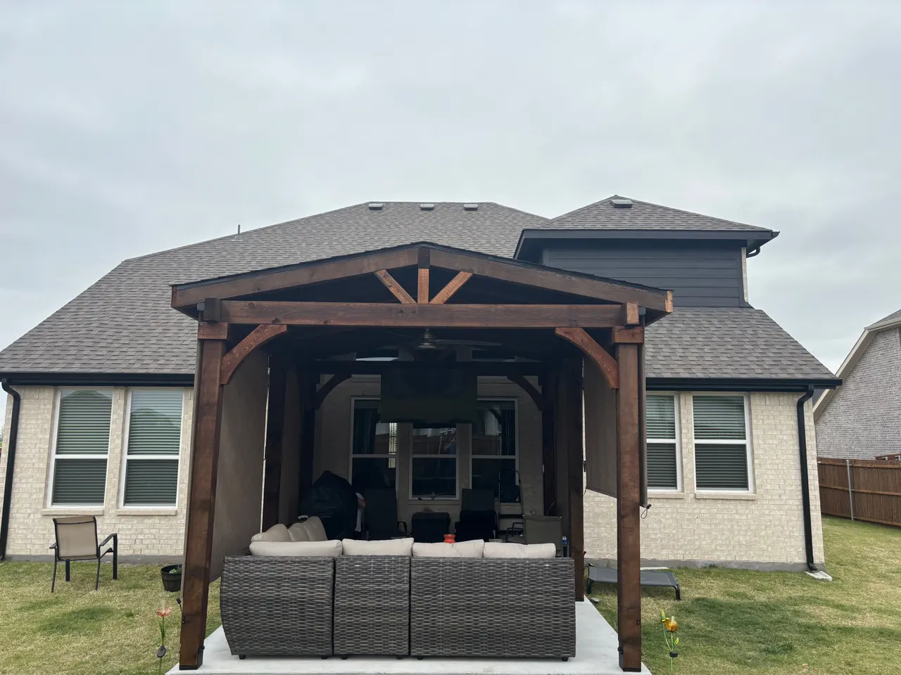 Western red cedar Gable style patio cover with roll down sun shades. — Lavon