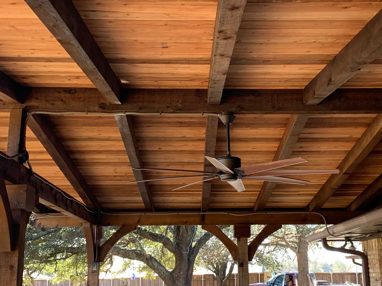 Western red cedar gable style patio with a composite deck. Oklahoma flagstone bars and benches with granite countertops. outdoor kitchen — Plano